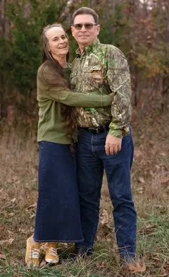 Must Be Frenchies breeders Lonnie and Catherine  on their Missouri farm