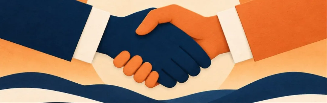 Two hands shaking in front of a sunset.