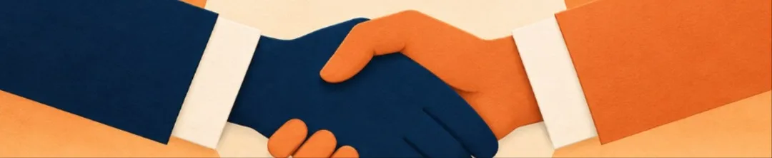 Two hands shaking in front of a sunset.