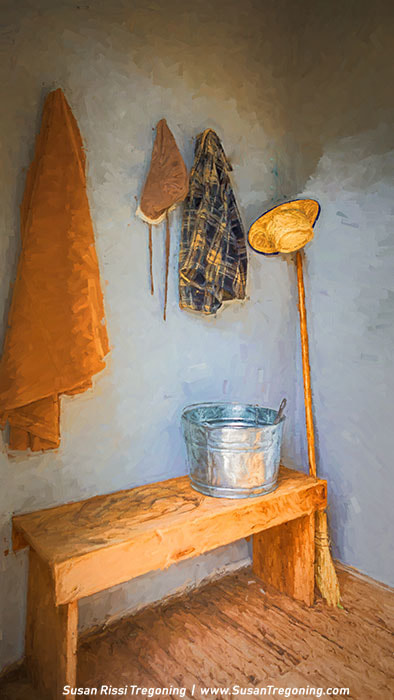 The coatroom of De Smet’s first school, evoking the setting from The Long Winter, with outerwear, hats, and a water pail arranged much as students would have left them during the harsh Dakota Territory winters.