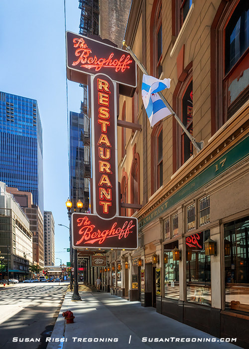 Tall vertical neon sign on the exterior of the Berghoff Restaurant’s historic building in the Chicago Loop.