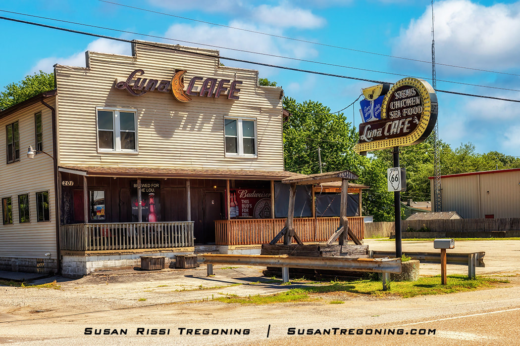 The exterior of the Luna Café in Mitchell, Illinois, is shown. The building dates to 1924, predating Route 66 by two years. It operated as a bar that became a restaurant during Prohibition and remains open today, though it no longer serves food.