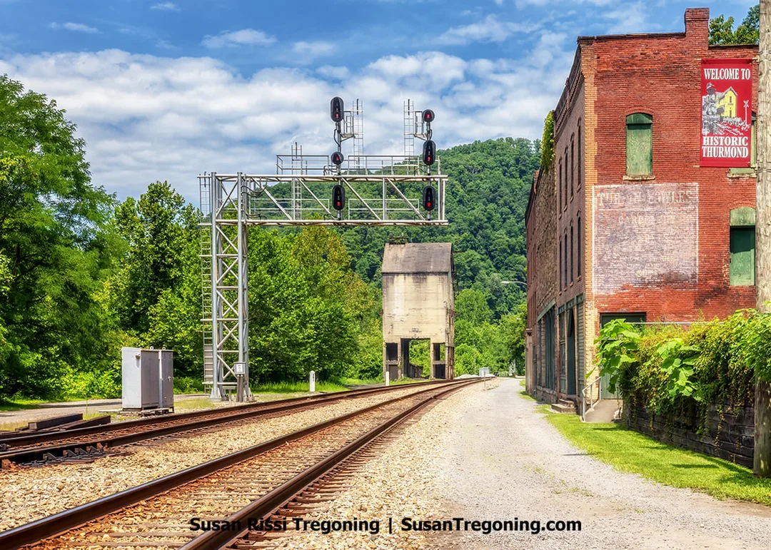 Tucked away in the abandoned town of Thurmond, West Virginia, lies the remains of Commercial Row. In this unique business district, the bustling Main Street diverged from the traditional road format and flourished as a network of railway tracks. The idea of locals navigating their daily lives just inches from the roaring locomotives that traverse these tracks captivates me.