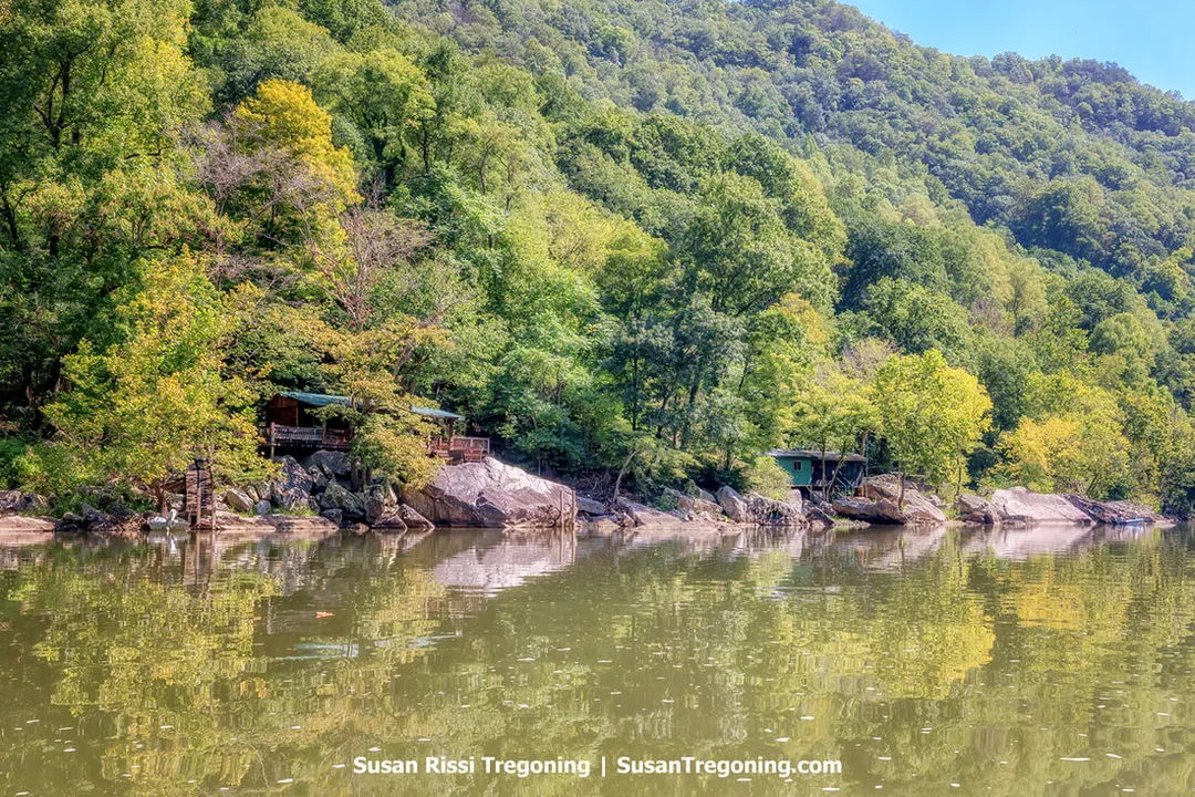 Cabins built among the massive rocks on the banks of the New River, located within the New River Gorge in West Virginia.