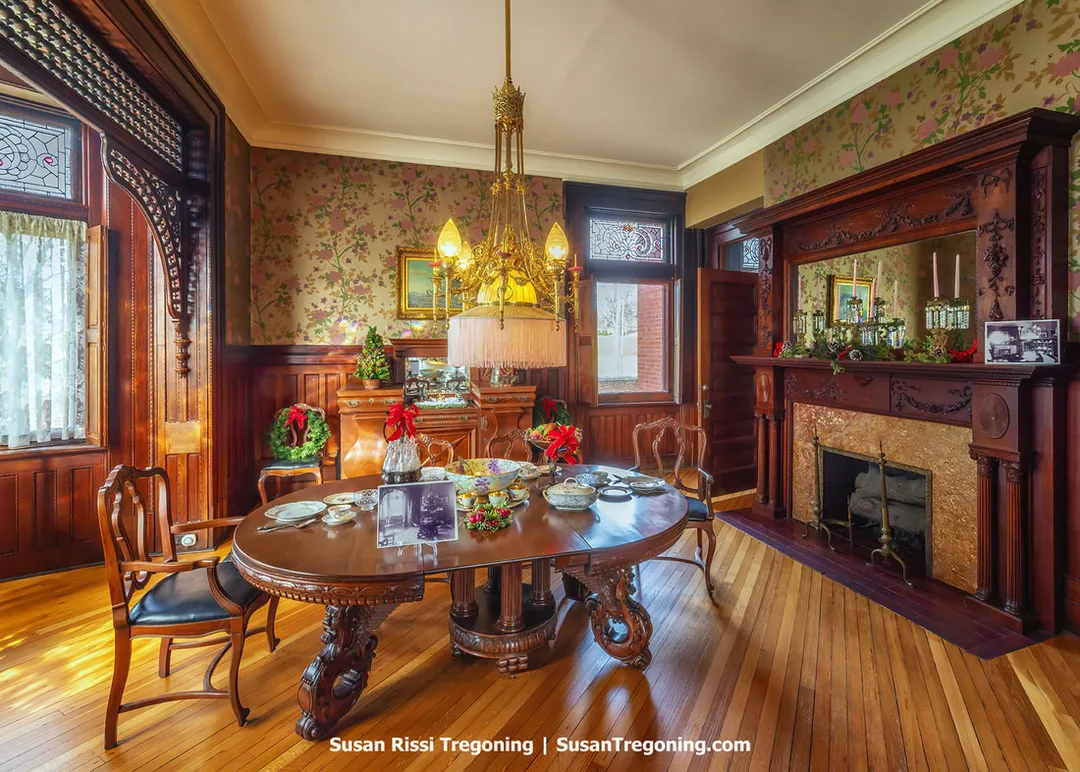 The dining room of the Howard Steamboat Museum, preserved with its Victorian furnishings, carved woodwork, and elegant period décor.