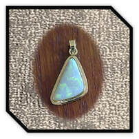 Main page item 9ct yellow gold & free-form solid opal pendant $1000D