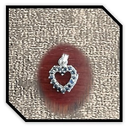 PE00750C-9ct White Gold Sapphire Heart Pendant.