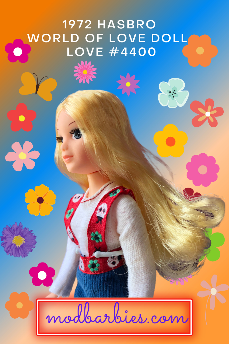World of Love doll is blonde and wearing green headband and colorful groovy outfit. 