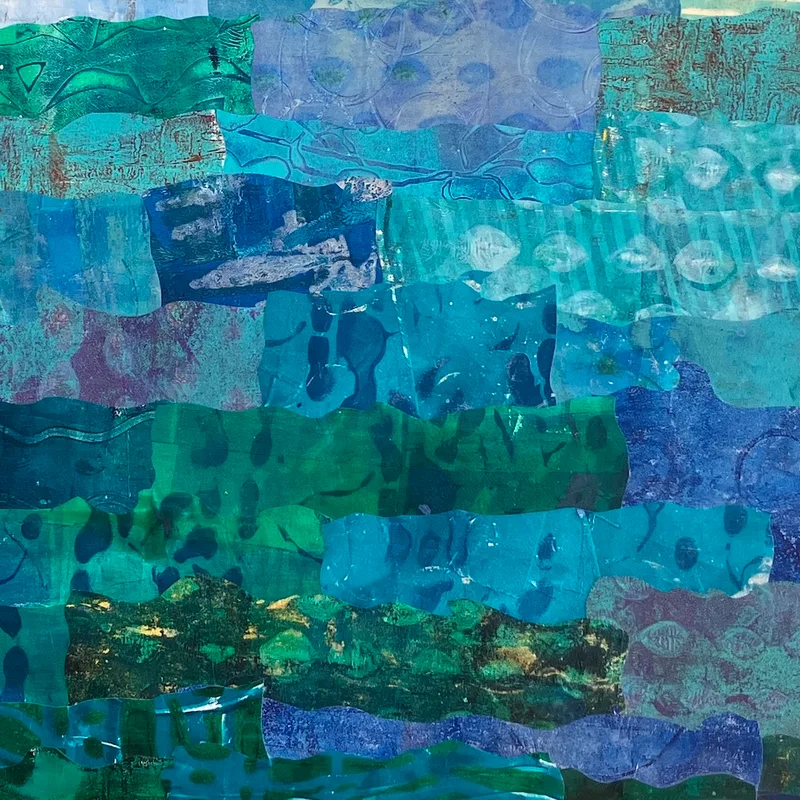 Detail of We Are Many in process stage. Blue collage papers layered to create ocean.