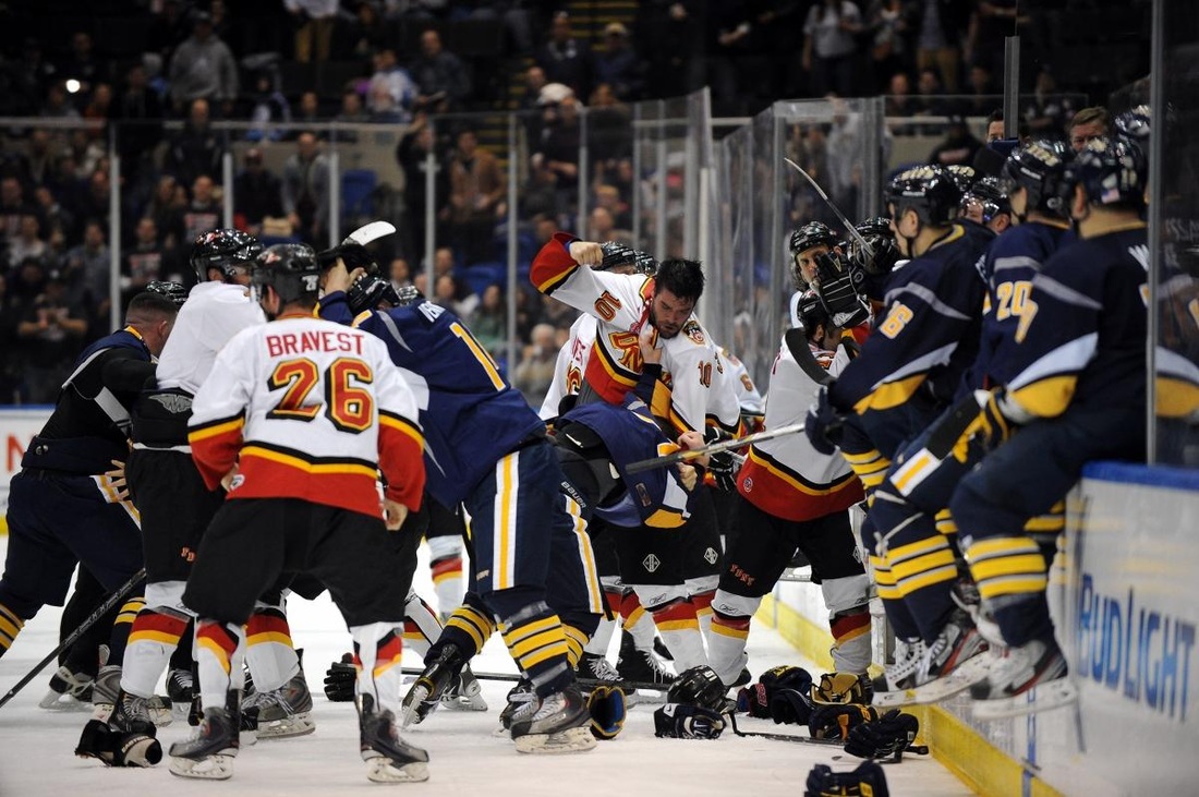 Watch the video! New York Cops and Firefighters brawl during charity hockey game