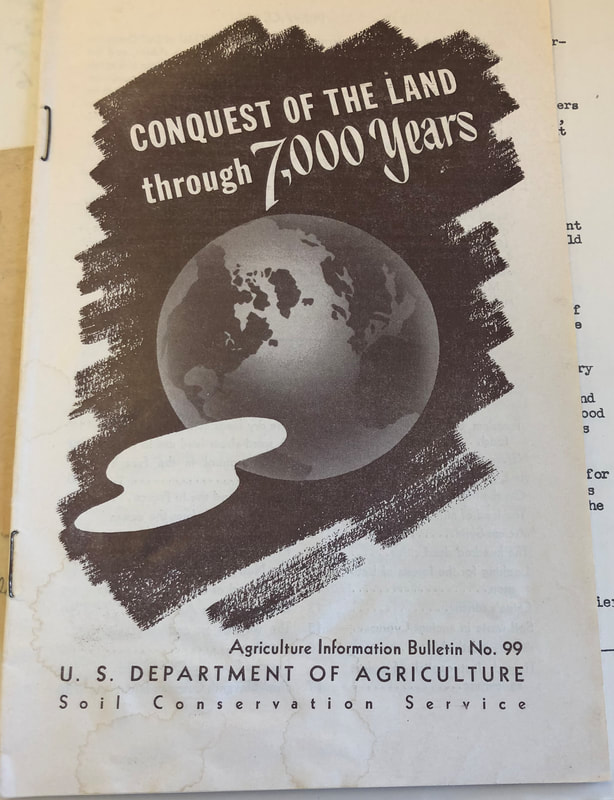 Walter Lowdermilk's pamphlet about agriculture in Palestine and beyond, with a black and white earth on it