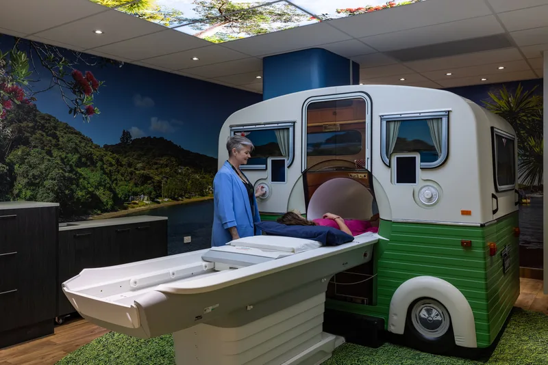 MRI patient bed positioned in front of the completed caravan-style shell
