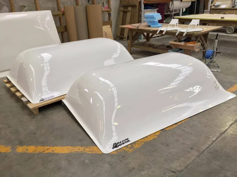 White fibreglass Breeze Busta wind deflectors in the FDL workshop