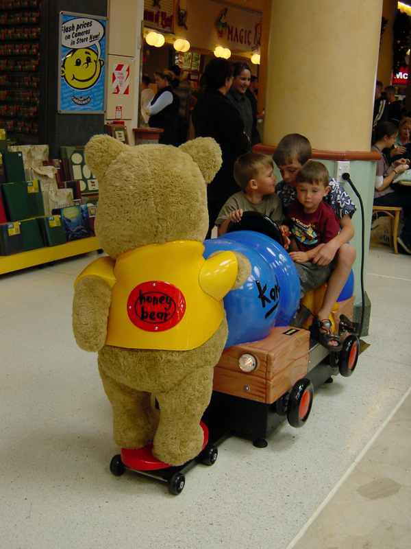 Rear view of the Honey Bear children’s ride with children seated inside