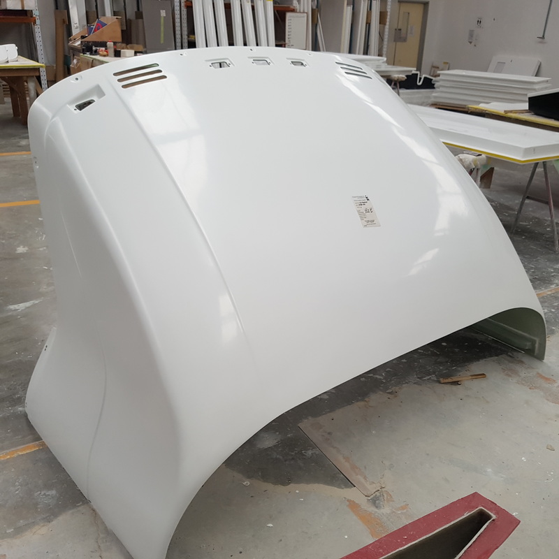 Large white fibreglass truck wind deflector in the workshop