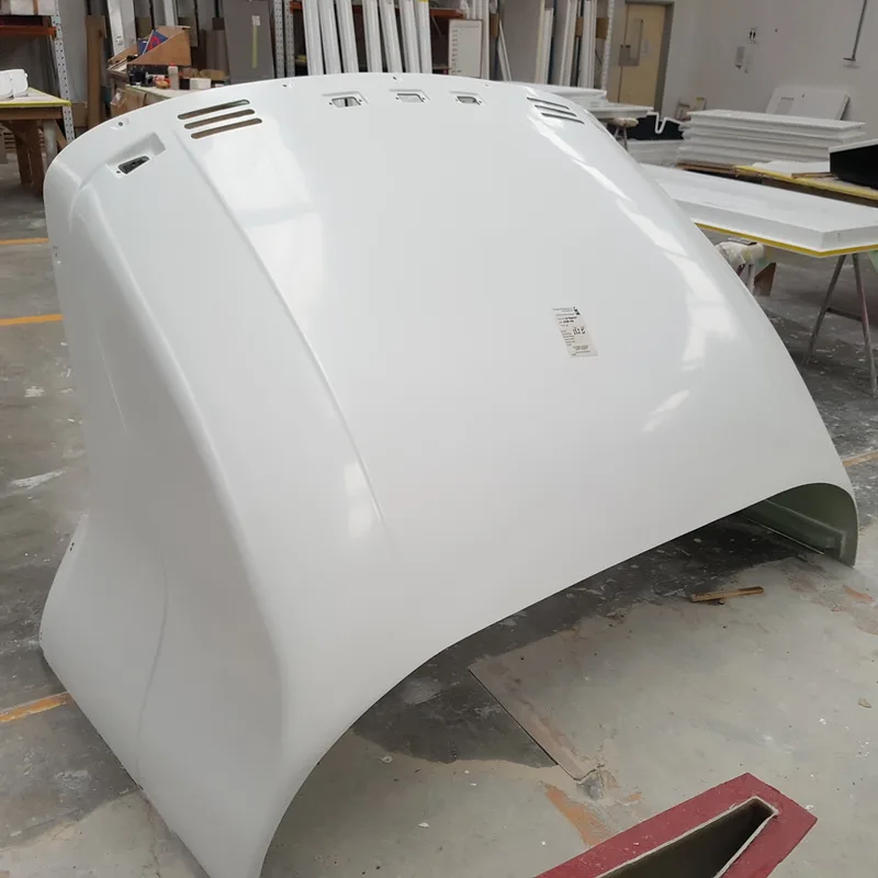 Large white fibreglass truck wind deflector in the workshop