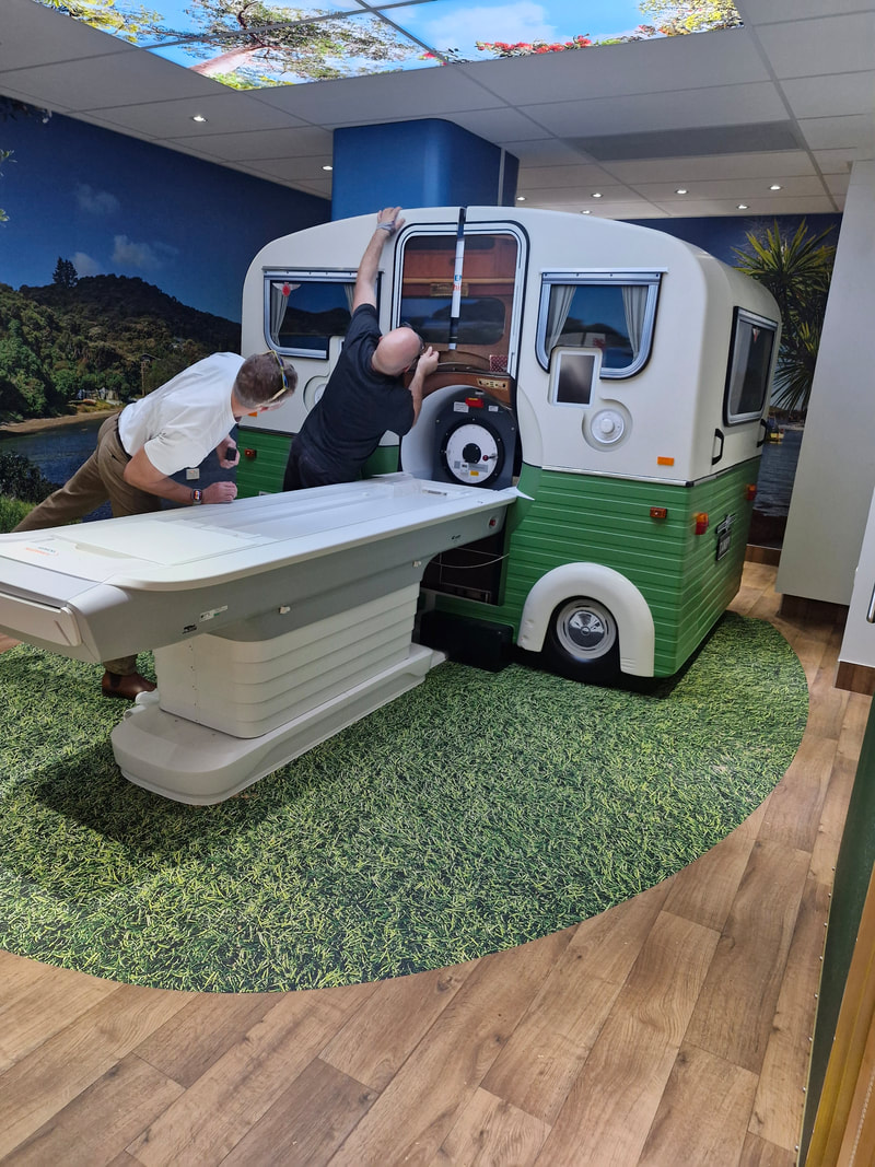 MRI caravan shell being assembled around the MRI machine in the completed room