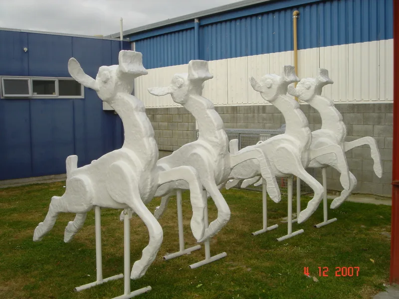 White fibreglass reindeer decorations lined up outside the workshop
