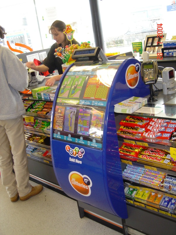 Curved Lotto display stand in a supermarket