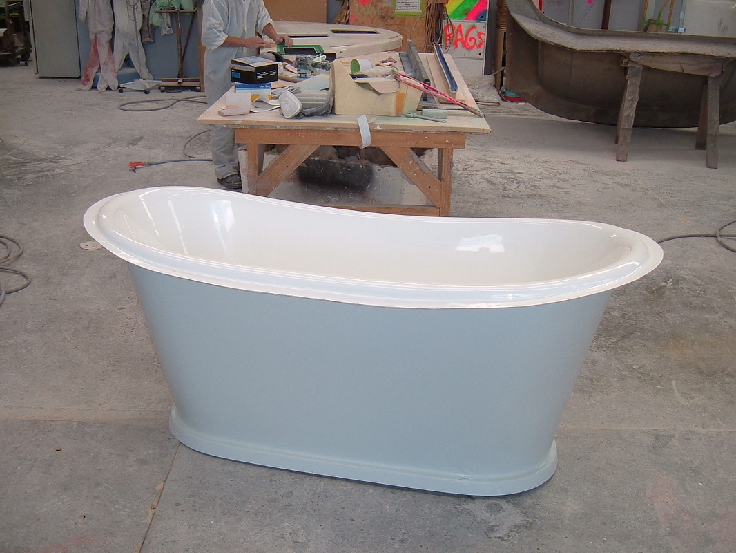 Pale blue freestanding Hiptub-style composite bath in the FDL workshop