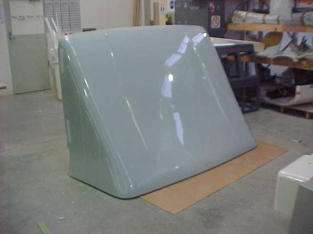 Upright white fibreglass Breeze Busta wind deflector in the workshop