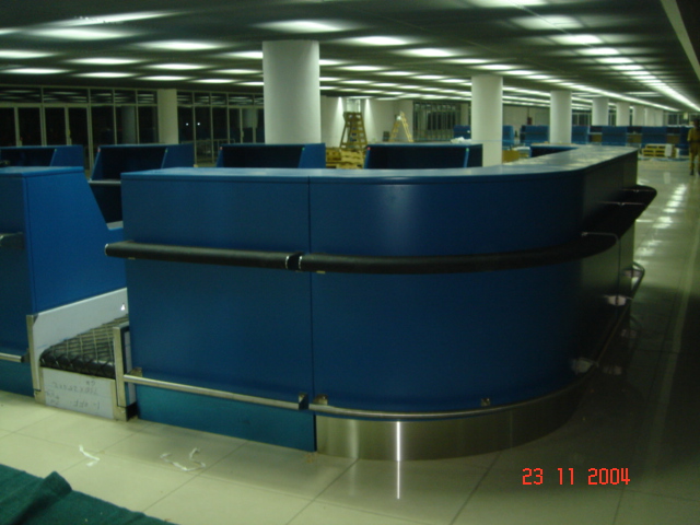 Completed curved blue airport service counter with stainless-steel detailing