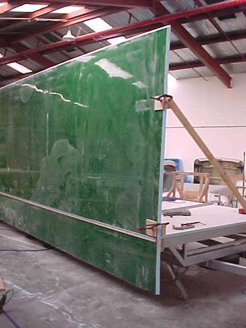 Exterior wall panel braced in position during Super Loo assembly