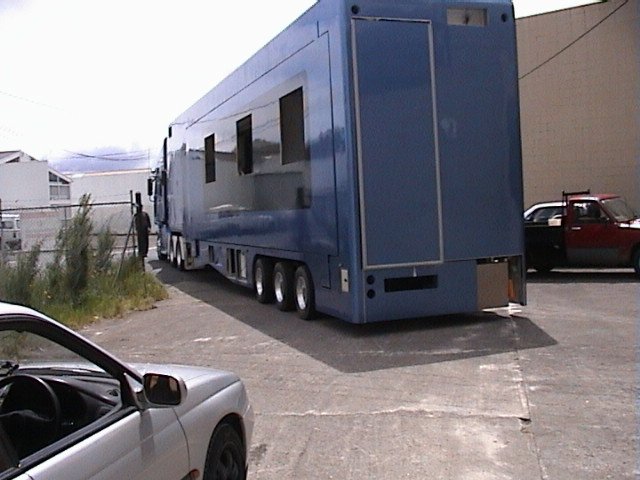 Rear three-quarter view of the mobile surgery unit and trailer before yellow detailing was added