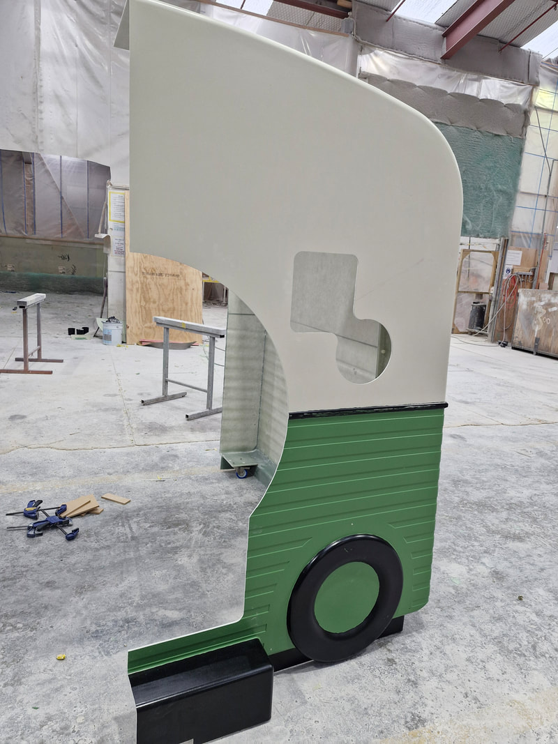 Side view of the MRI caravan shell during assembly in the workshop
