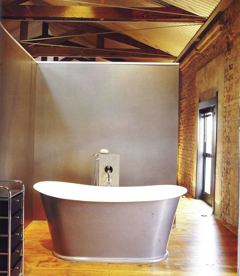Grey composite bath in a rustic interior