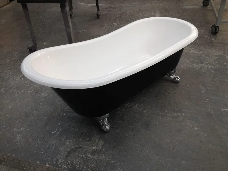 Black and white clawfoot composite bath in the workshop