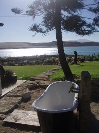 Black and white bath overlooking the water