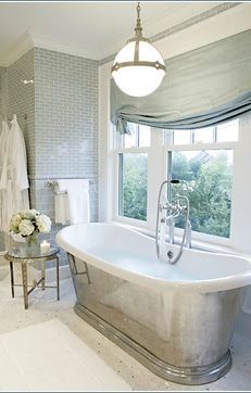 White composite bath in a bright bathroom