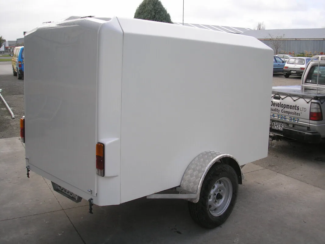 White moulded fibreglass commercial trailer body manufactured for Hobbs Trailers