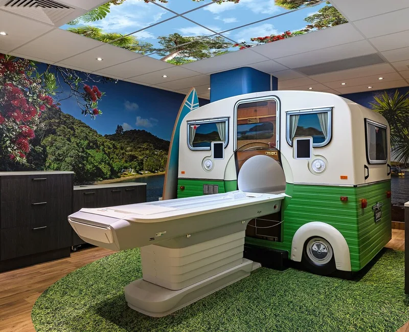 Retro caravan-style shell enclosing an MRI machine in the completed scan room