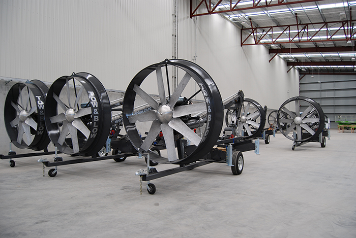 Tow & Blow portable wind machines lined up in a warehouse
