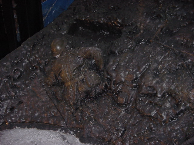 Close-up of the sculpted battlefield detail on the trench exhibit panel