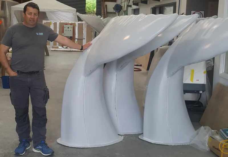 Unpainted fibreglass whale-tail sculptures manufactured for Auckland’s Whale Tales art trail