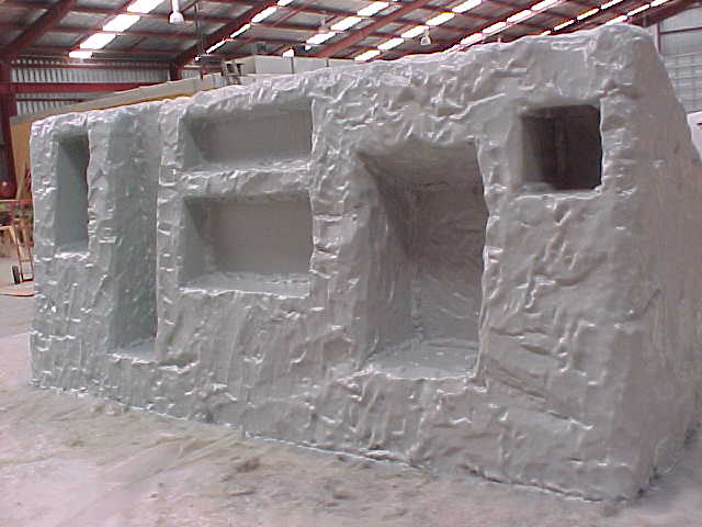 Unfinished fibreglass trench display structure in the workshop