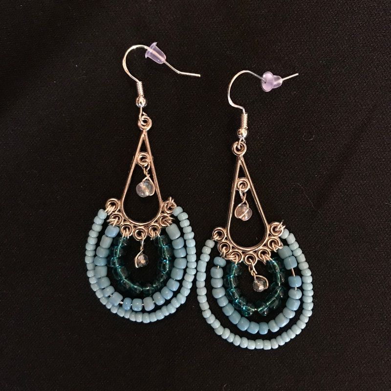 drop earrings with clear beads and blue beads in all shades
