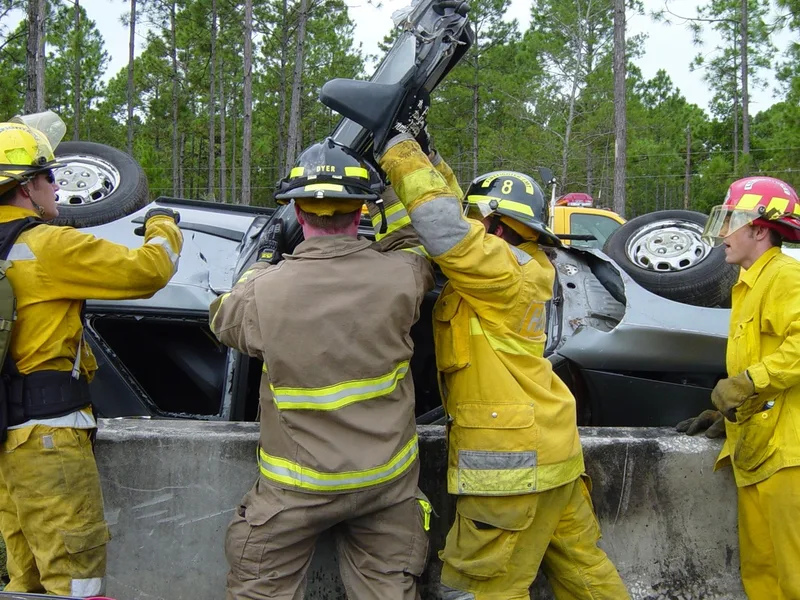 Opening door of wrecked vehicle against barrier picture