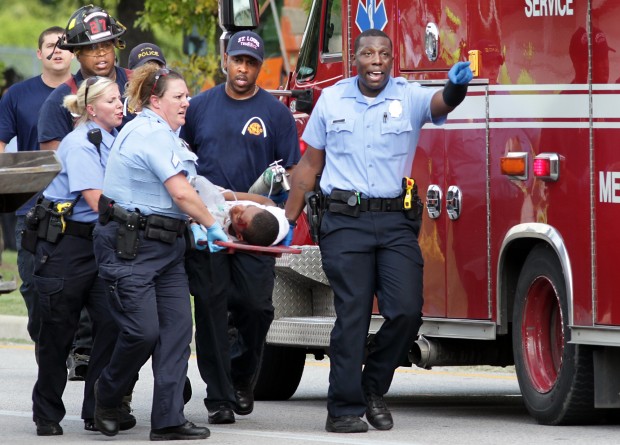 Patient being transported on a backboard