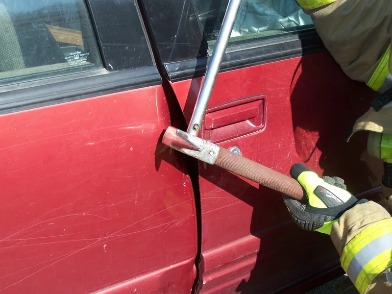Pry Axe raising up to open a door picture