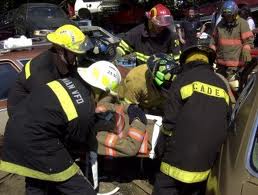 Patient being loaded onto a backboard for transport