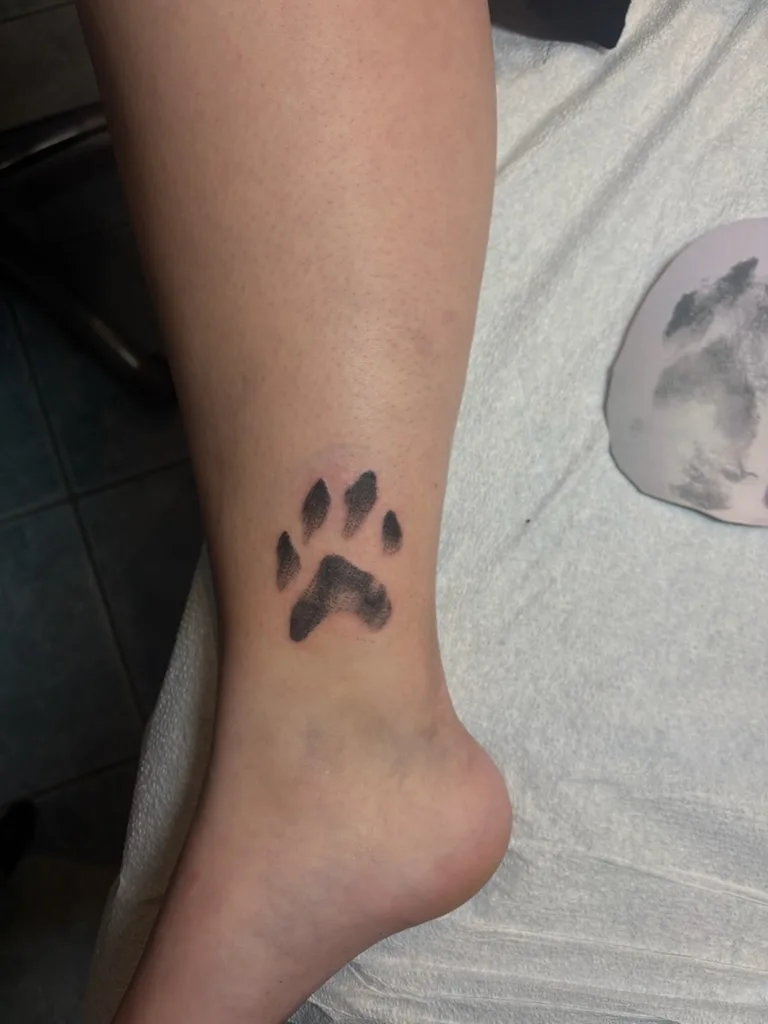 Dog paw print by Jesse Grim in on Skin