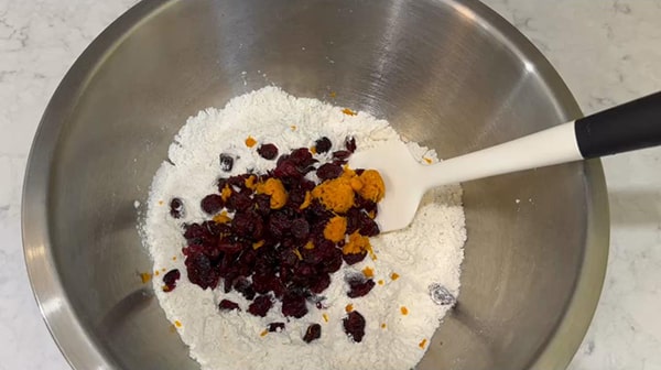 No Knead Dutch Oven Bread Stir Dried Cranberries and Orange Zest