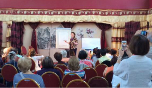 Picture of Virginia demonstrating in London, England to a capacity crowd