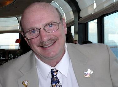 Photo of gallery manager and Disney Glass Slipper Concierge travel adviser Duane Whitman.