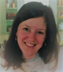 Photo of Cindy Goeller, LCPC, LMHC, smiling into the camera.