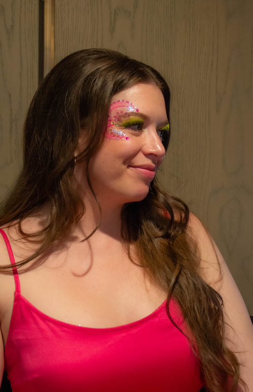 A woman in Berkeley, California, wearing a hand made jewel cluster from the Bling Bar